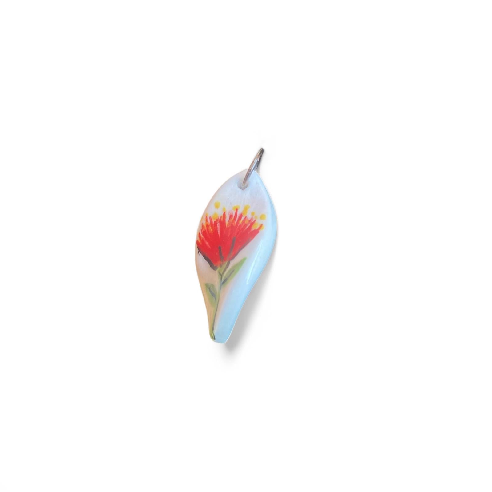 Necklace with a Pohutuukawa flower pendant on a white background