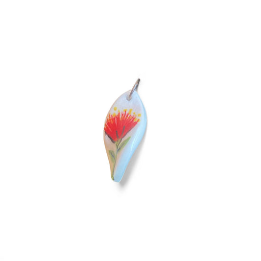 Necklace with a Pohutuukawa flower pendant on a white background