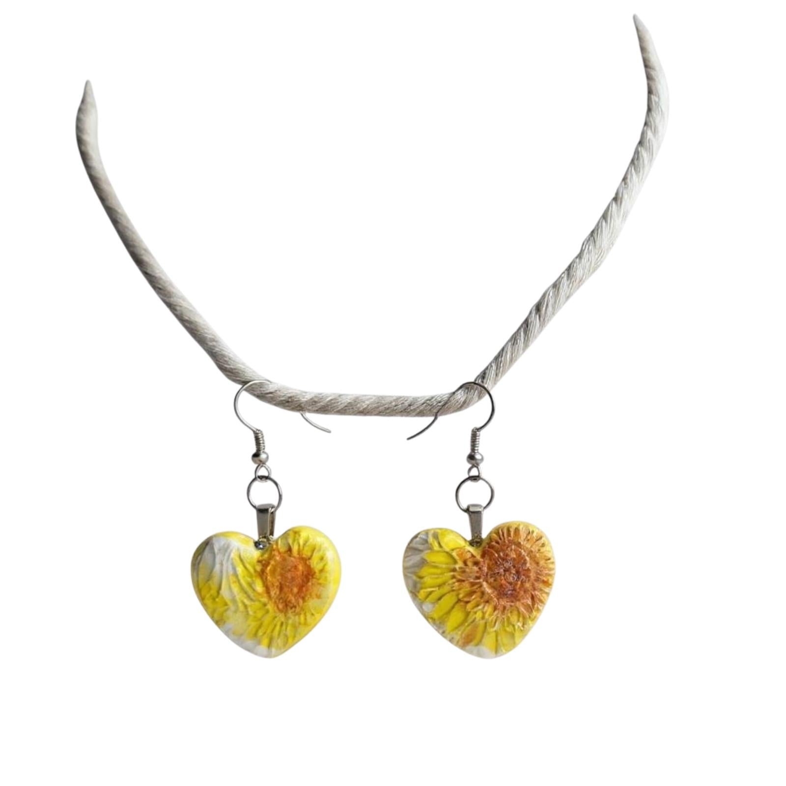 Heart-shaped earrings with floral design on a white background
