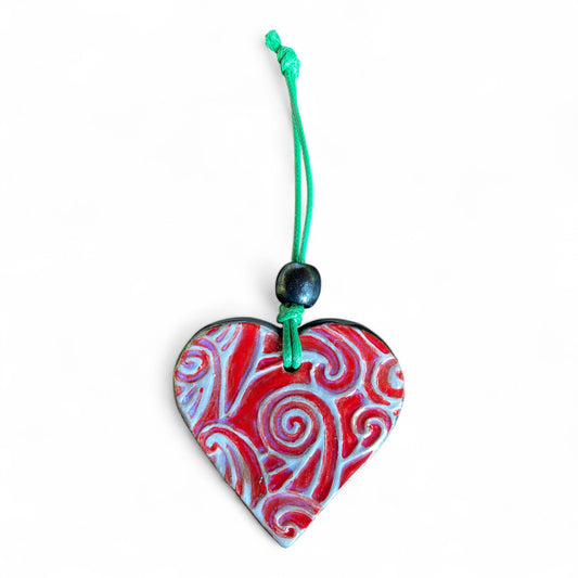 Terracot heart shaped essential oil diffuser in Maori Design.