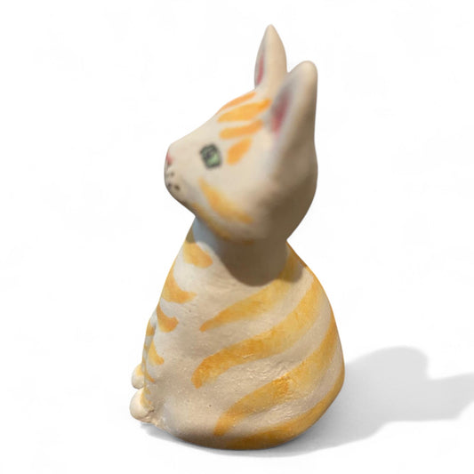 Porcelain yellow striped cat figurine
