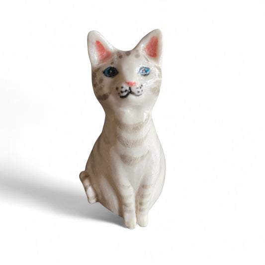 "Lady Cynthia" Small porcelain cat figurine on a white background
