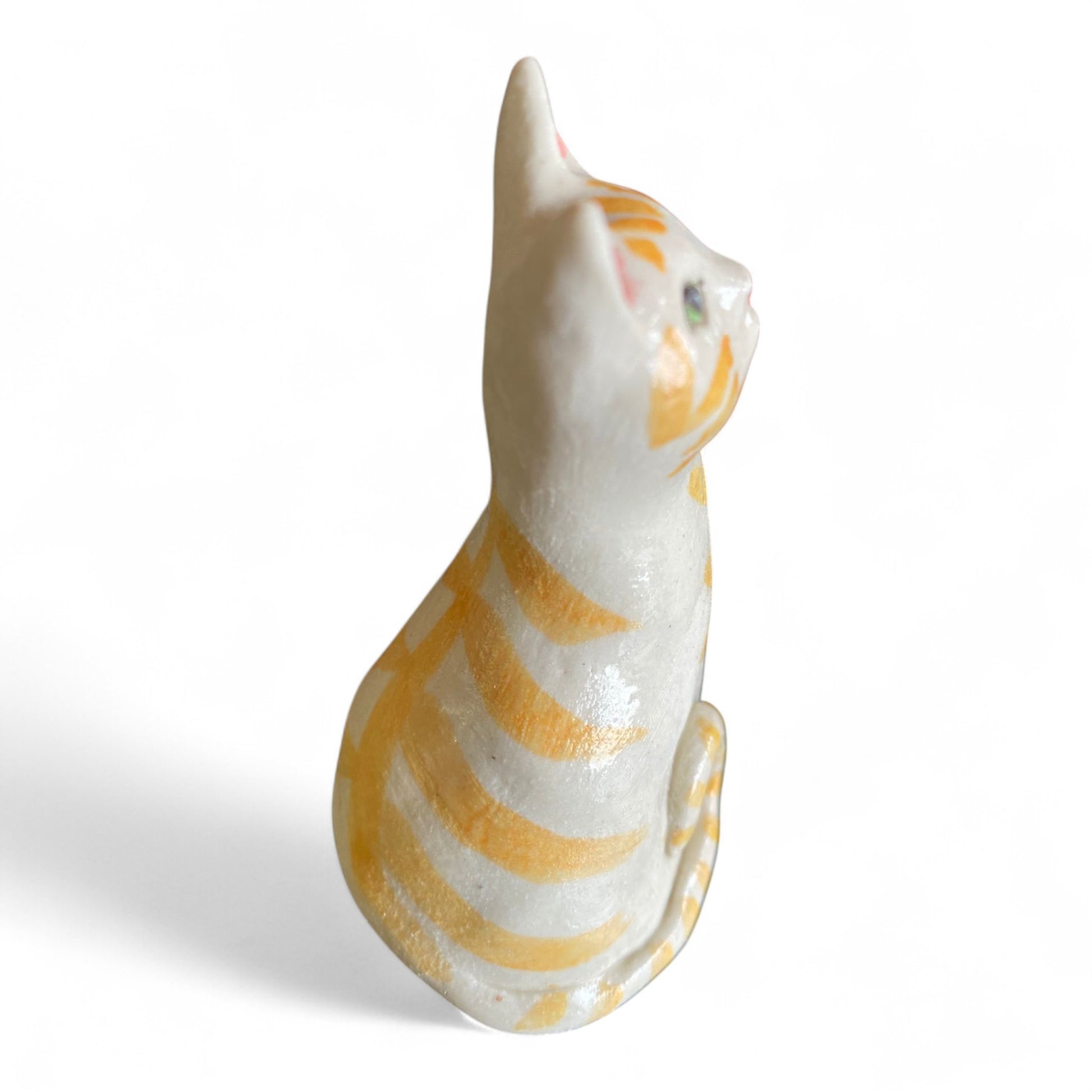 Porcelain Cat sculpture with yellow stripes