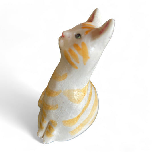 Porcelain Cat sculpture with yellow stripes