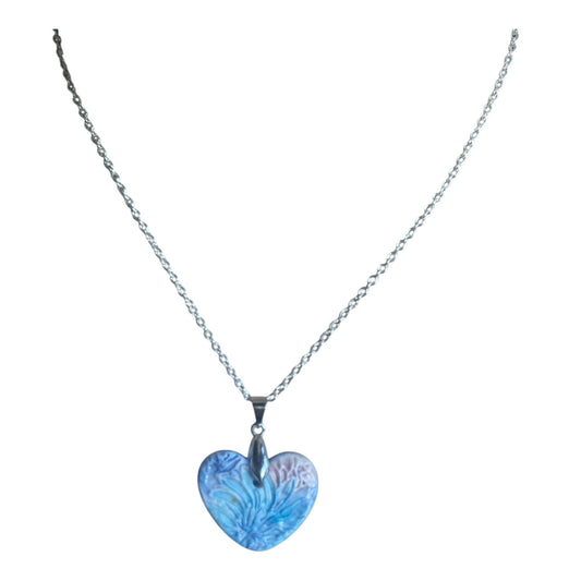 Necklace with a floral blue heart-shaped pendant on a white background
