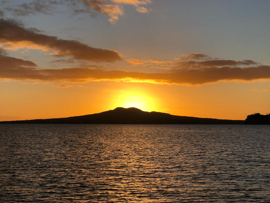 Hand-painted heart decoration depicting two yachts sailing in front of Rangitoto Island, Auckland, New Zealand.