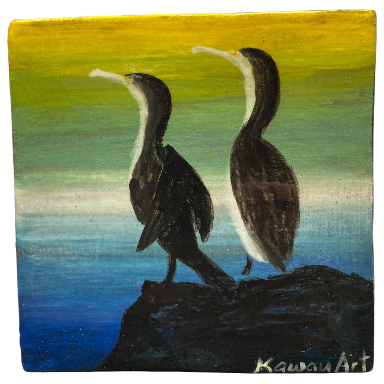 Two NZ Shag birds on a rock with a gradient background