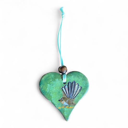 Terracot heart shaped essential oil diffuser with a fantail.