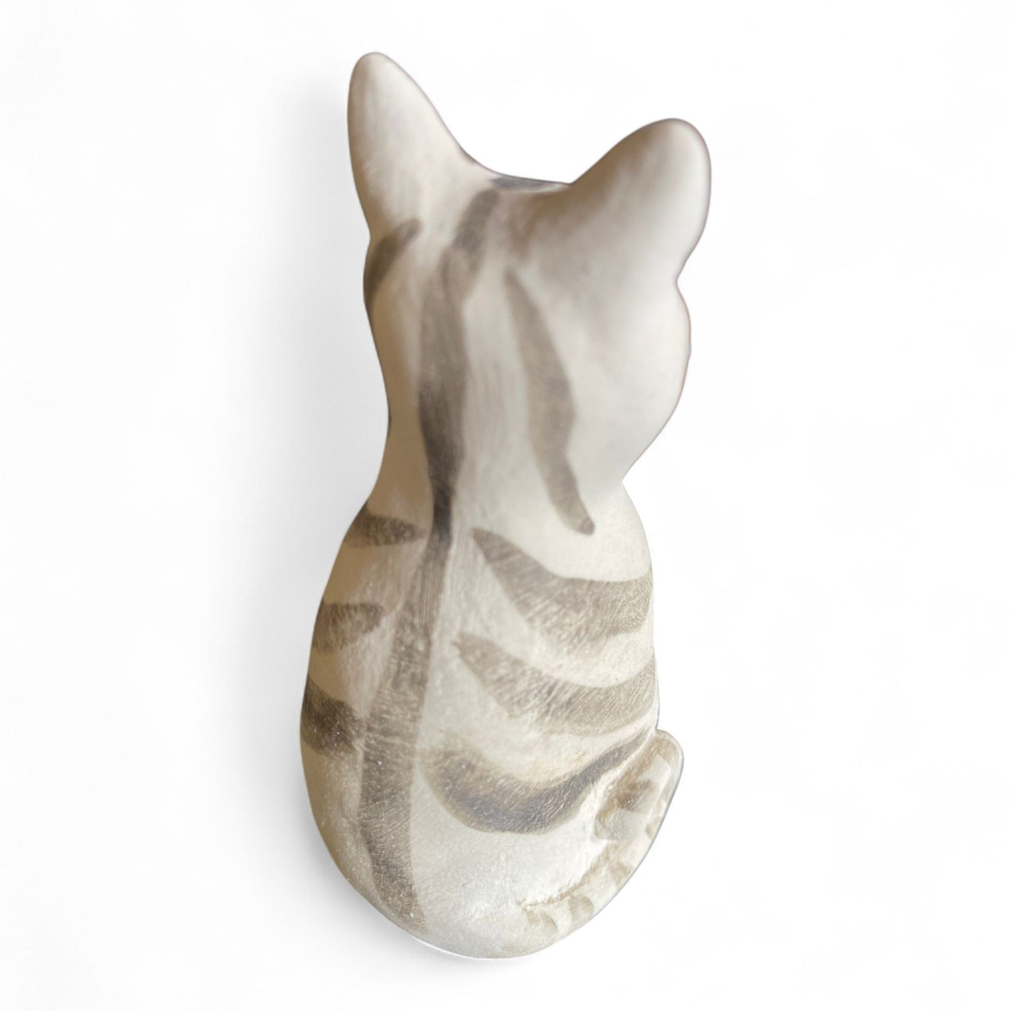 Porcelan stripws cat figurine on a white background