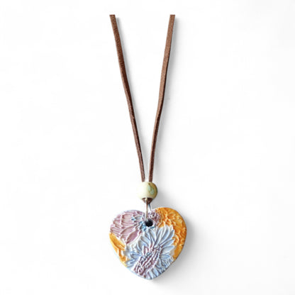 Ceramic pendant with Van Gogh Sunflower designed by Yoko d'Arnaud - Celsius Ceramics.
